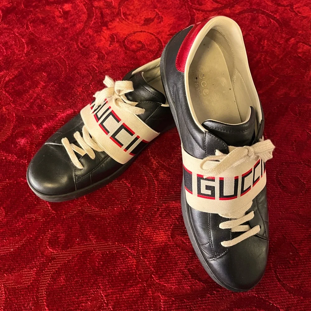 Gucci Black Leather Sneakers with Beige Logo Strap and Red Heel Accent